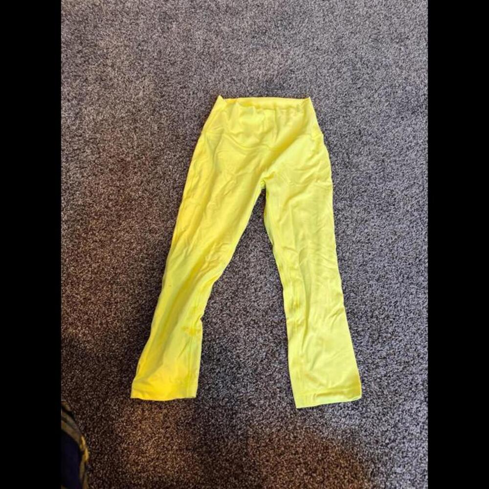 Bright yellow Lululemon cropped leggings